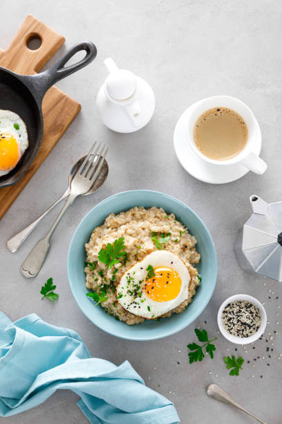istock Savoury oatmeal with fried eggs sunny side up for breakfast 1287194213