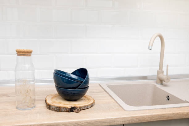 istock Modern kitchen countertop with domestic culinary utensils on it 1287195752