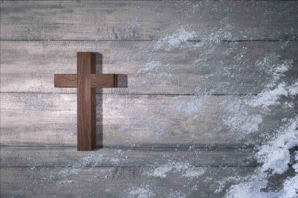 istock Christian cross with snow 1287195971