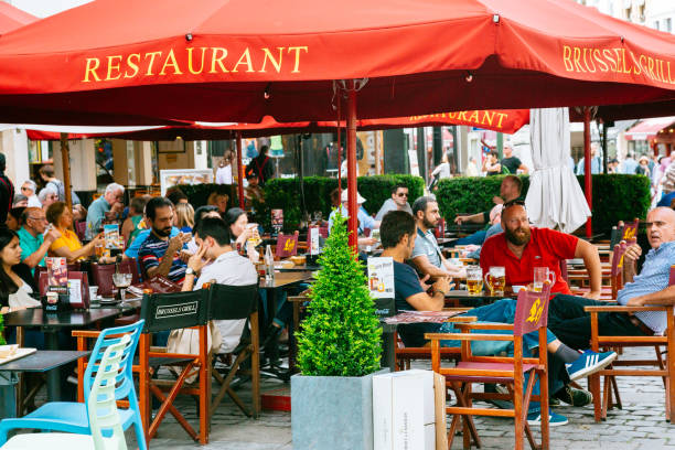 Centre of Brussels - People chilling on the summer terrace of a restaurant.