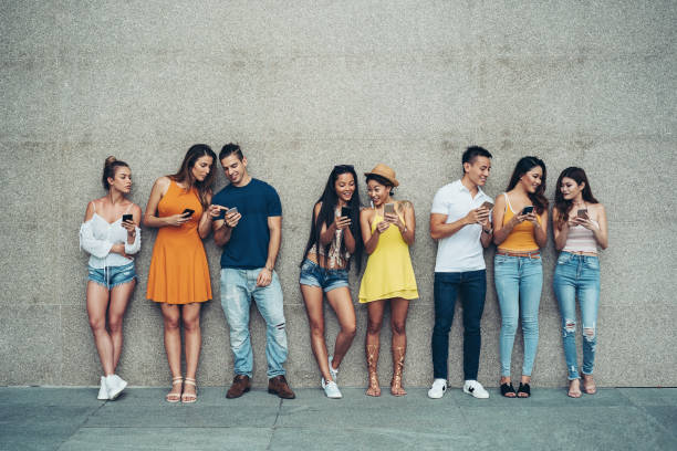 istock Multi-ethnic group in a social media and networking concept 1287197895