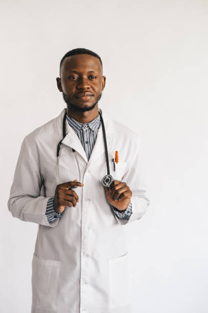 istock black medic in a white coat on a white background with a statoscope 1287197949