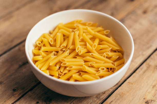 istock Ingredients for a pasta salad on an old wooden table 1287198184