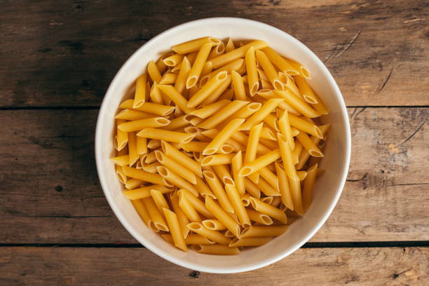 istock Ingredients for a pasta salad on an old wooden table 1287198187