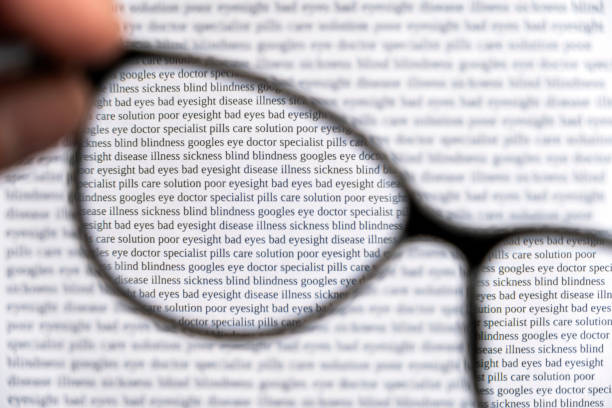 Reading Glasses on Wood Background. Optical Vision. Shot with a Canon EOS Mark V.
