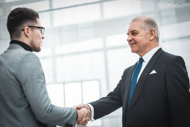 istock firm business handshake on a blurry office background 1287203497