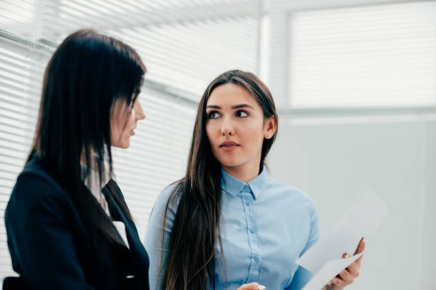 istock two young employees discussing business documents. photo with copy-space 1287203560
