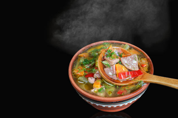 istock Soup with vegetables and sausage, close-up in a spoon 1287204527