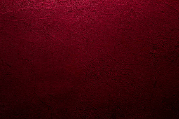istock Crimson abstract textured wall background in red 1287205954