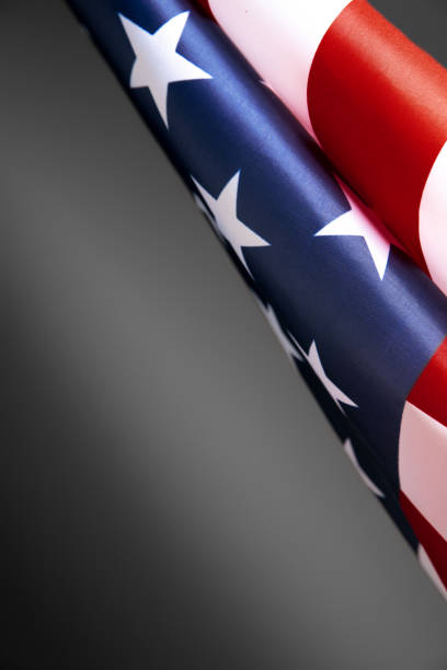 istock Flag of USA on grey studio background. Copyspace for text, image 1287206132