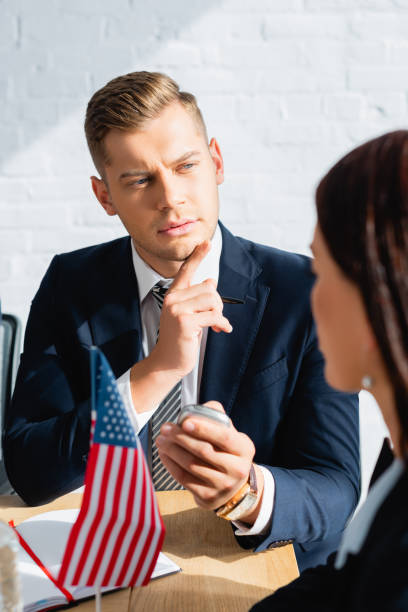 istock journalist with dictaphone interviewing politician during party congress on blurred foreground 1287206268