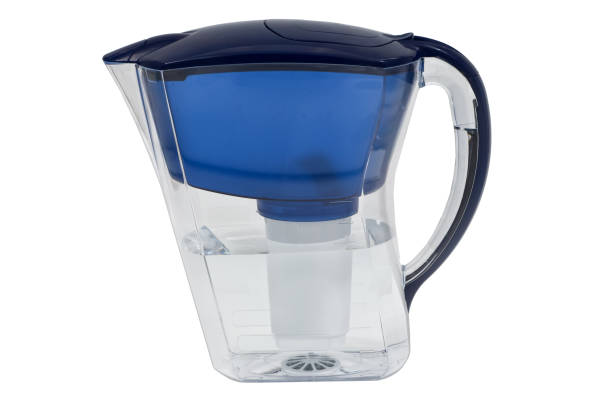 istock Water filter jug with of clean water isolated on white background 1287207966