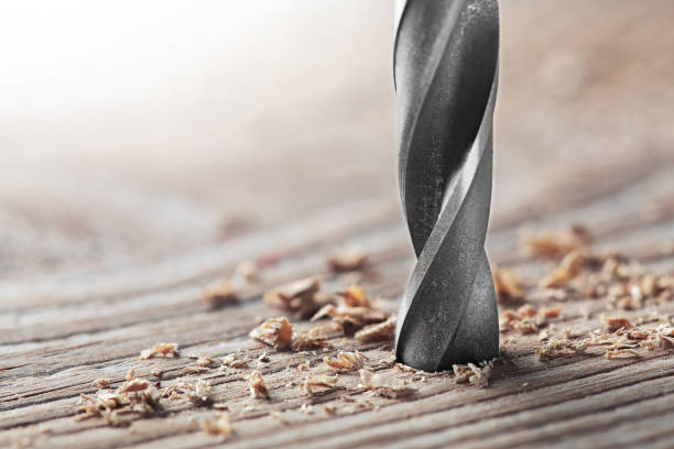 istock metal drill bit make holes in old wooden plank 1287207989