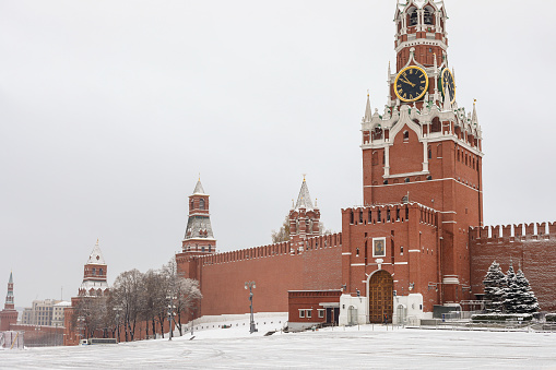 Moscow - Russia, November 23rd, 2020 - The first snow of the year arrived in Moscow and the Red Square is completely covered. Kremlin under the snow.