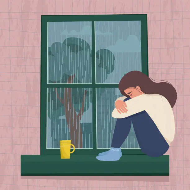 Vector illustration of Depressed woman sitting by the window.  Seasonal depression concept. Cute vector illustration in cartoon flat style