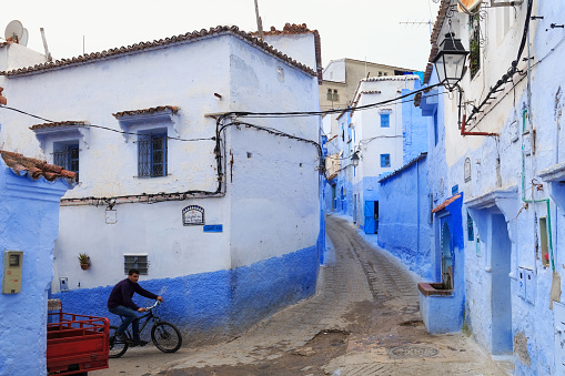 CHEFCHAOUEN, MOROCCO - MAY 28, 2017: View of the blue walls of Medina in Chaouen. The city is noted for its buildings in shades of blue and that makes Chefchaouen very attractive to visitors.