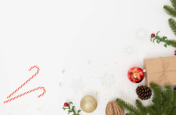 istock Christmas holiday composition and decoration on white background with pine branches, flat lay 1287213518
