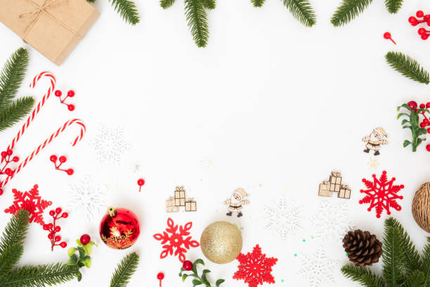 istock Christmas holiday composition and decoration on white background with gift box and pine branches, flat lay 1287214037