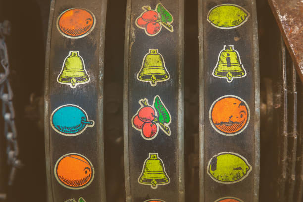 Retro styled image of a close up of a weathered vintage slot machine