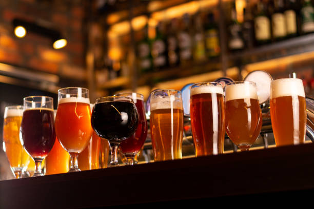 tasty craft beer on bar table a lot of beer on bar table glass of beer stock pictures, royalty-free photos & images