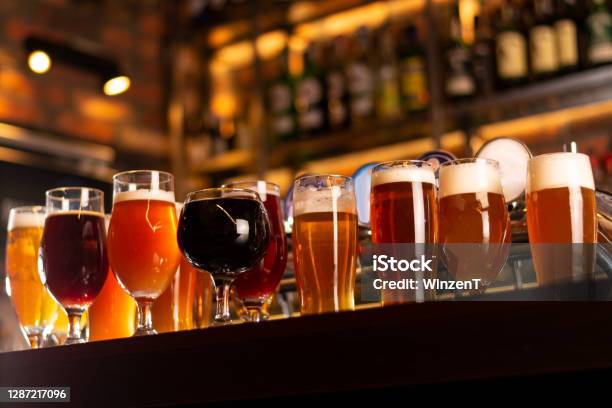 Tasty Craft Beer On Bar Table Stock Photo - Download Image Now - Beer - Alcohol, Craft Beer, Brewery