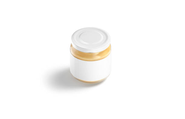 istock Blank small glass jar with label and peanut butter mockup 1287218349