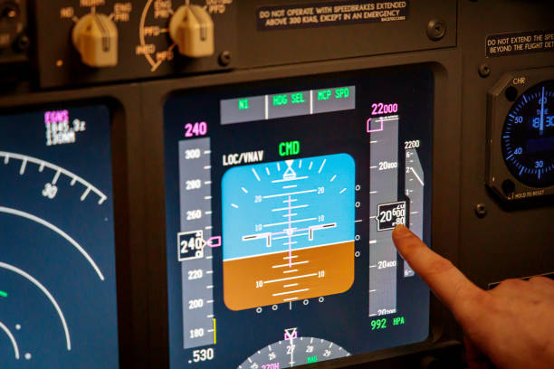 Flight instruments of a modern jet airliner A pilot pointing out the altitude display, on the primary flight instruments of a modern jet airliner. flight instruments stock pictures, royalty-free photos & images