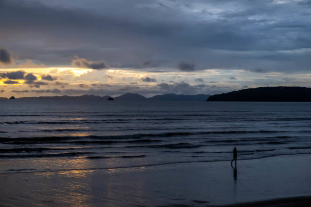 istock Silhouette of beautiful sea beach in twilight time 1287220184