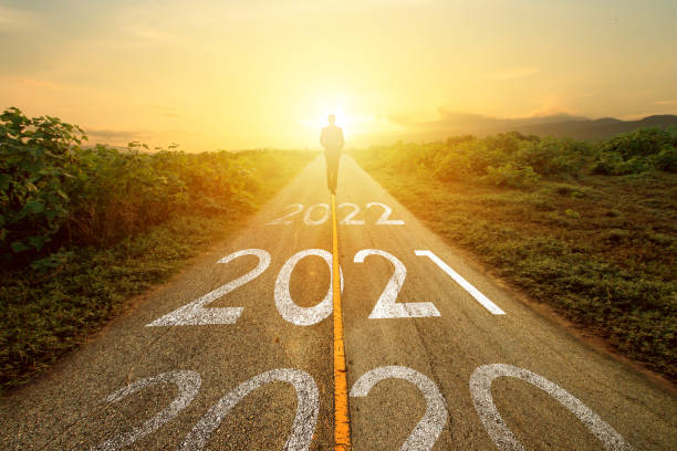 istock Businessman walk on road with 2021 year 1287220293