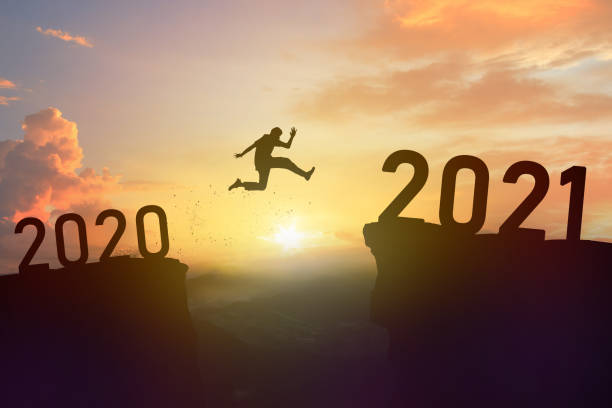 istock Man jump 2020 to 2021 new year 1287220322