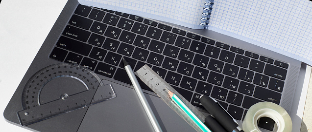 Laptop Ng Ruler The Laptop Screen Is Covered By A Squared Notebook On The Keyboard Is A ...