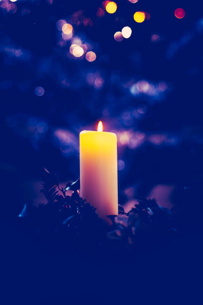 istock Decorative Christmas Candle Flame at Night 1287222414