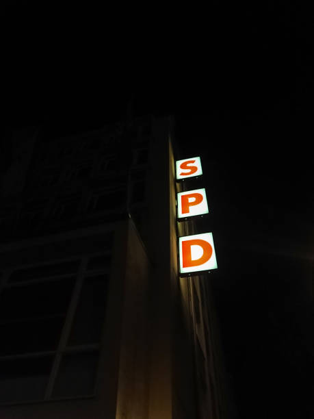 SPD vertical sign at night Berlin, Germany - May 7, 2017: SPD sign outside the head office at night. Social Democratic Party of Germany (Sozialdemokratische Partei Deutschlands) is a social-democratic political party in Germany german social democratic party photos stock pictures, royalty-free photos & images