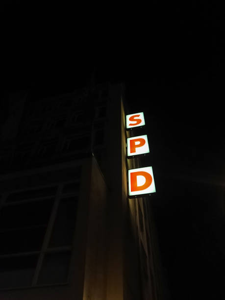 SPD vertical sign at night Berlin, Germany - May 7, 2017: SPD sign outside the head office at night. Social Democratic Party of Germany (Sozialdemokratische Partei Deutschlands) is a social-democratic political party in Germany campaign headquarters stock pictures, royalty-free photos & images