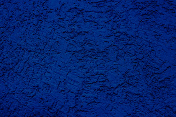 istock The wall is made of plaster. Rough surface. Solid color abstract background. 1287226893