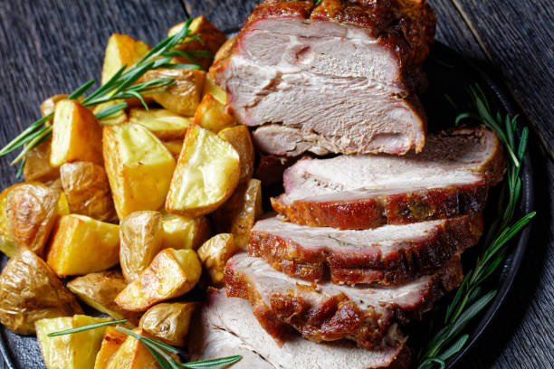 istock American sunday roast dinner: roasted pork loin with baked potato 1287228708