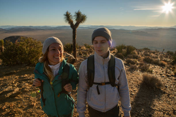 istock Hikers at sunrise enjoy nature 1287228782