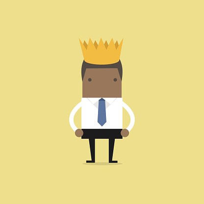 African businessman wearing a crown.