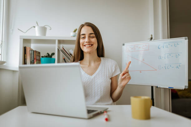 istock Young female teacher is having online class. 1287230574