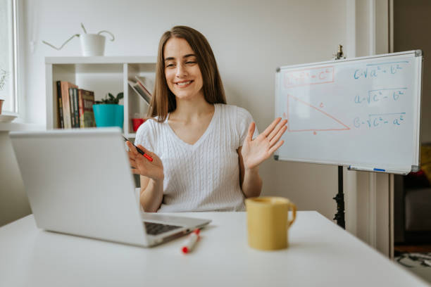 istock Young female teacher is having online class. 1287231447