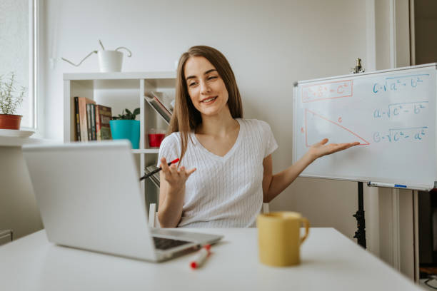 istock Young female teacher is having online class. 1287231644