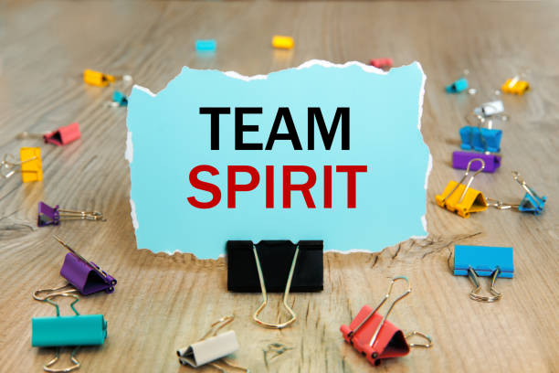 istock TEAM SPIRIT - writing on torn paper. 1287232501