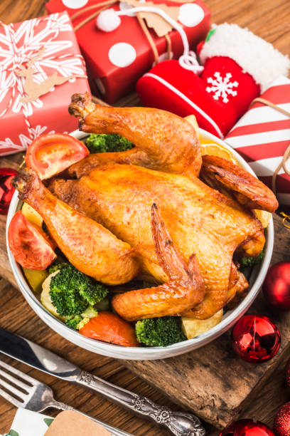 istock Roasted whole chicken with Christmas decoration. 1287233905