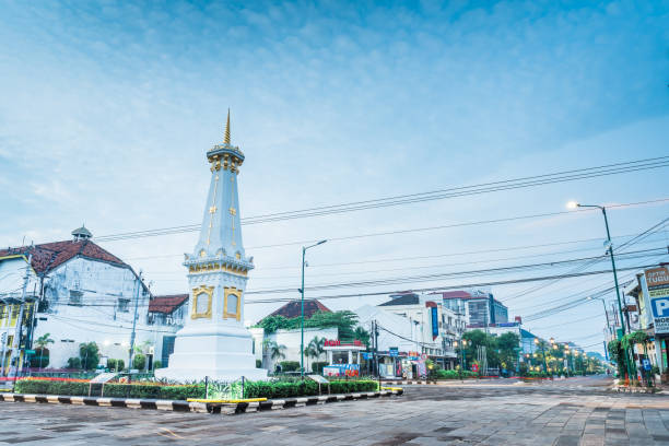 Tugu Yogyakarta one of famous landmark Yogyakarta, Indonesia - April 30, 2020:  empty street view in the morning at Yogyakarta landmark Tugu jogja.
Empty street as picture shown, as local government in Yogyakarta ordering social distancing because of coronavirus yogyakarta stock pictures, royalty-free photos & images