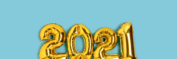 istock Cover with 2021 made from gold balloons on a blue background. 1287237690