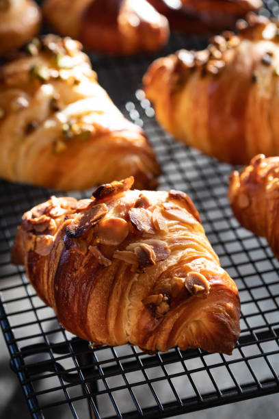 istock Homemade croissants on cooling rack 1287238592