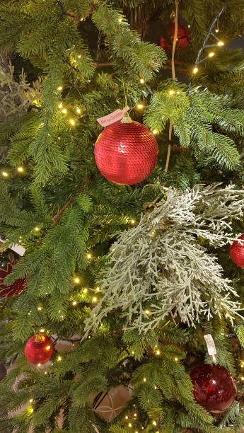 istock Vertical shot of Christmas ornaments on tree 1287239896