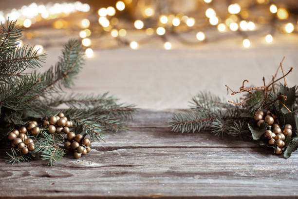 istock Christmas background with branches of a christmas tree on a wooden table copy space. 1287247650