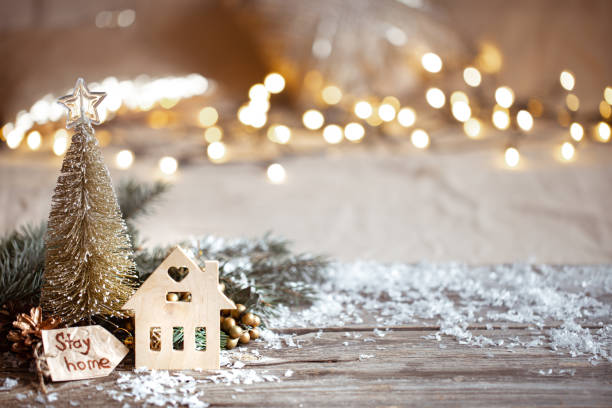 istock Christmas cozy background with decor details, snow and blurry lights copy space. 1287247657