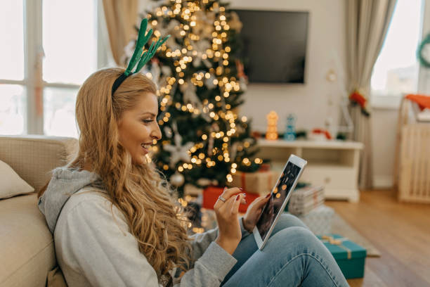 istock Young woman working from home during Christmas 1287247681